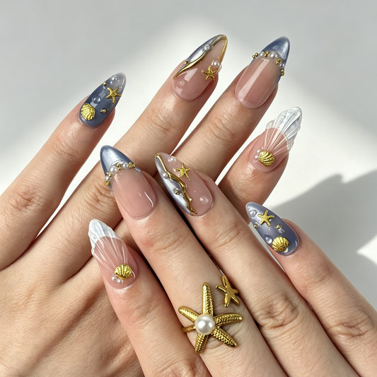 Lilac Tide lilac gradient almond press on nails worn on hand, gold foil seashell starfish soft beach manicure
