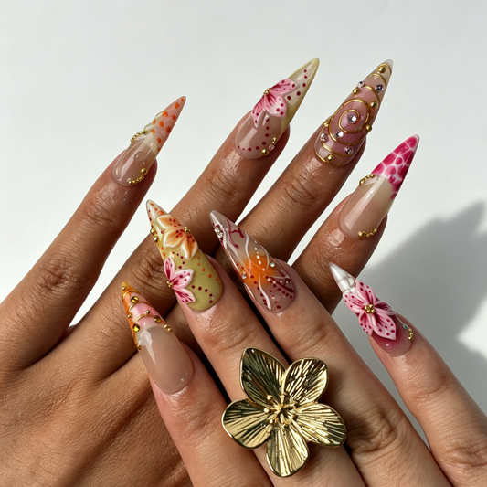 Peach Filigree romantic long stiletto false nails close-up, translucent pink flower and gold swirl dating manicure