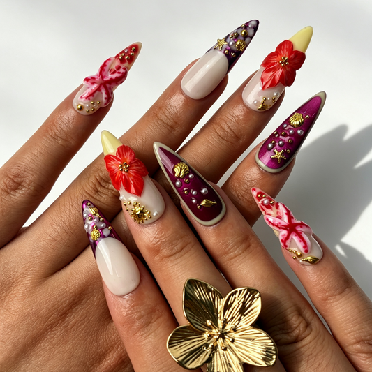 Coral Tide vivid long stiletto false nails close-up, ocean floral shell starfish pearl vacation manicure