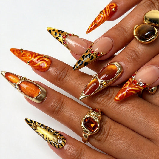 Wild Amber stiletto press on nails, safari tiger print orange flame nail art on hand