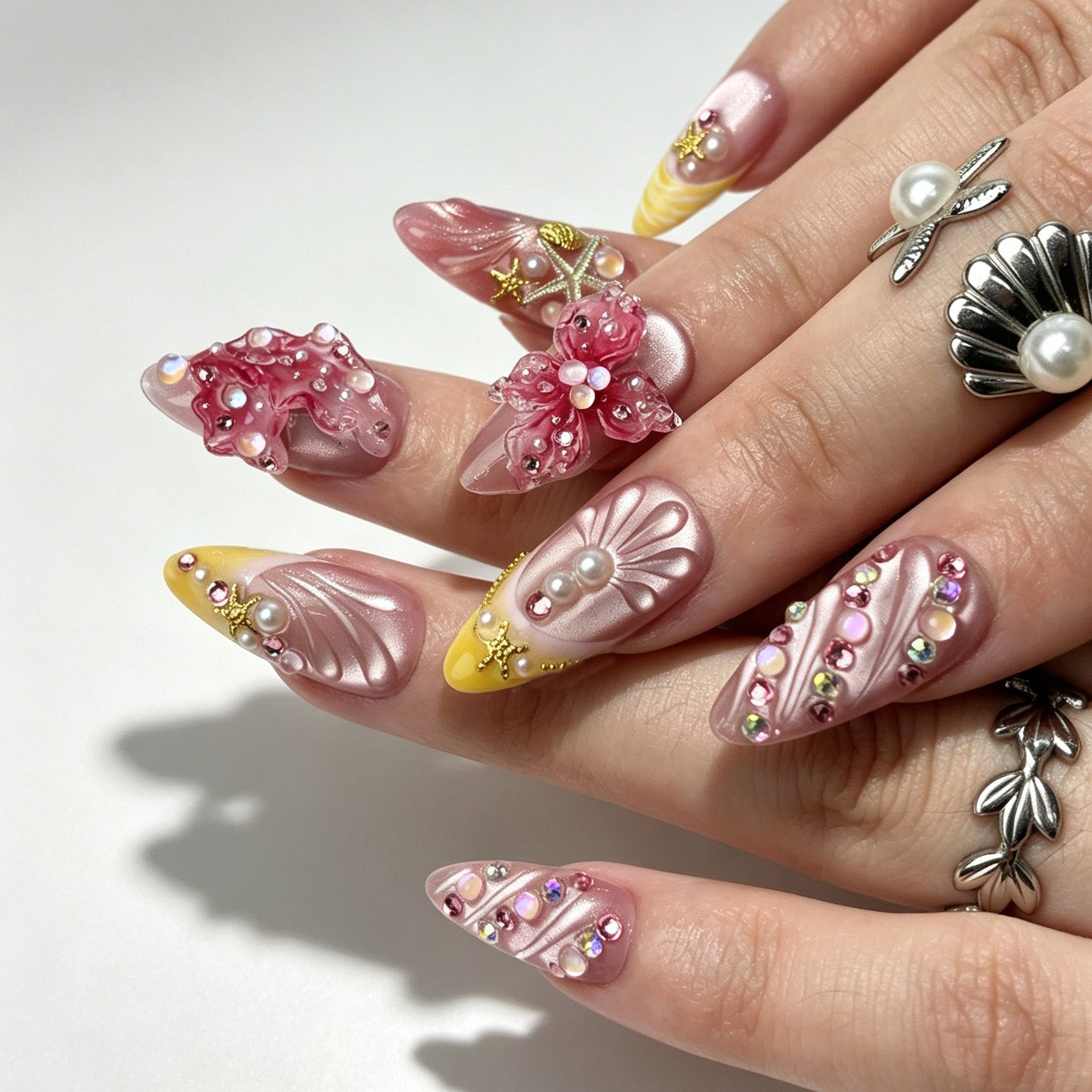 Aesthetic pink yellow ocean handmade press on nails long almond worn on hand natural light