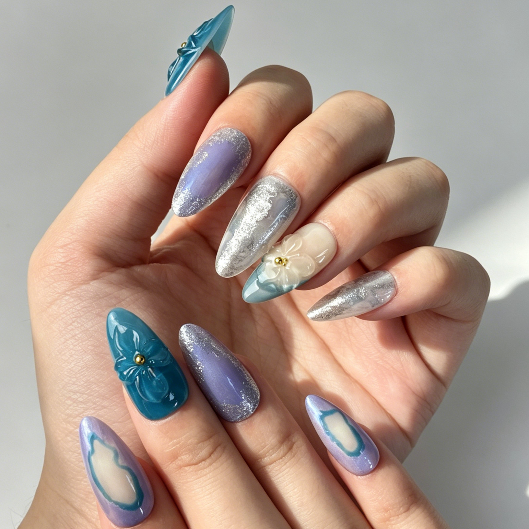 Close Up 3D Embossed Nail Art, Teal Purple Silver Foil Floral Decor, Medium Almond Gradient Press On Nail Detail Shot