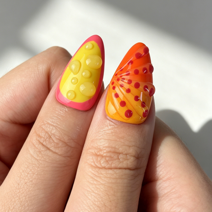 Glossy citrus themed false nails medium almond tropical vacation nail art