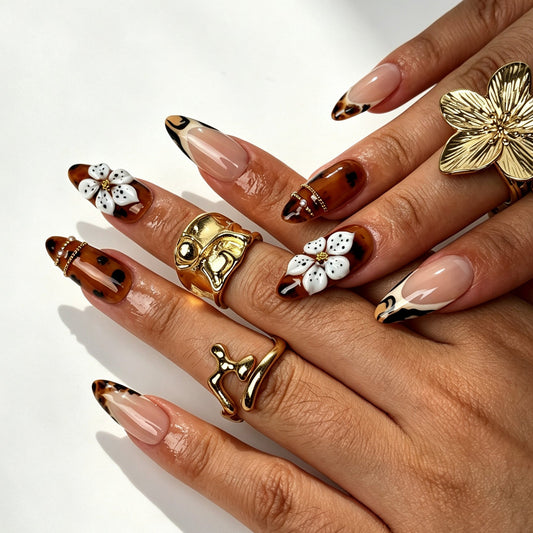 Amber Blaze handmade almond press on nails, bold tortoiseshell tiger French tip nail art on hand