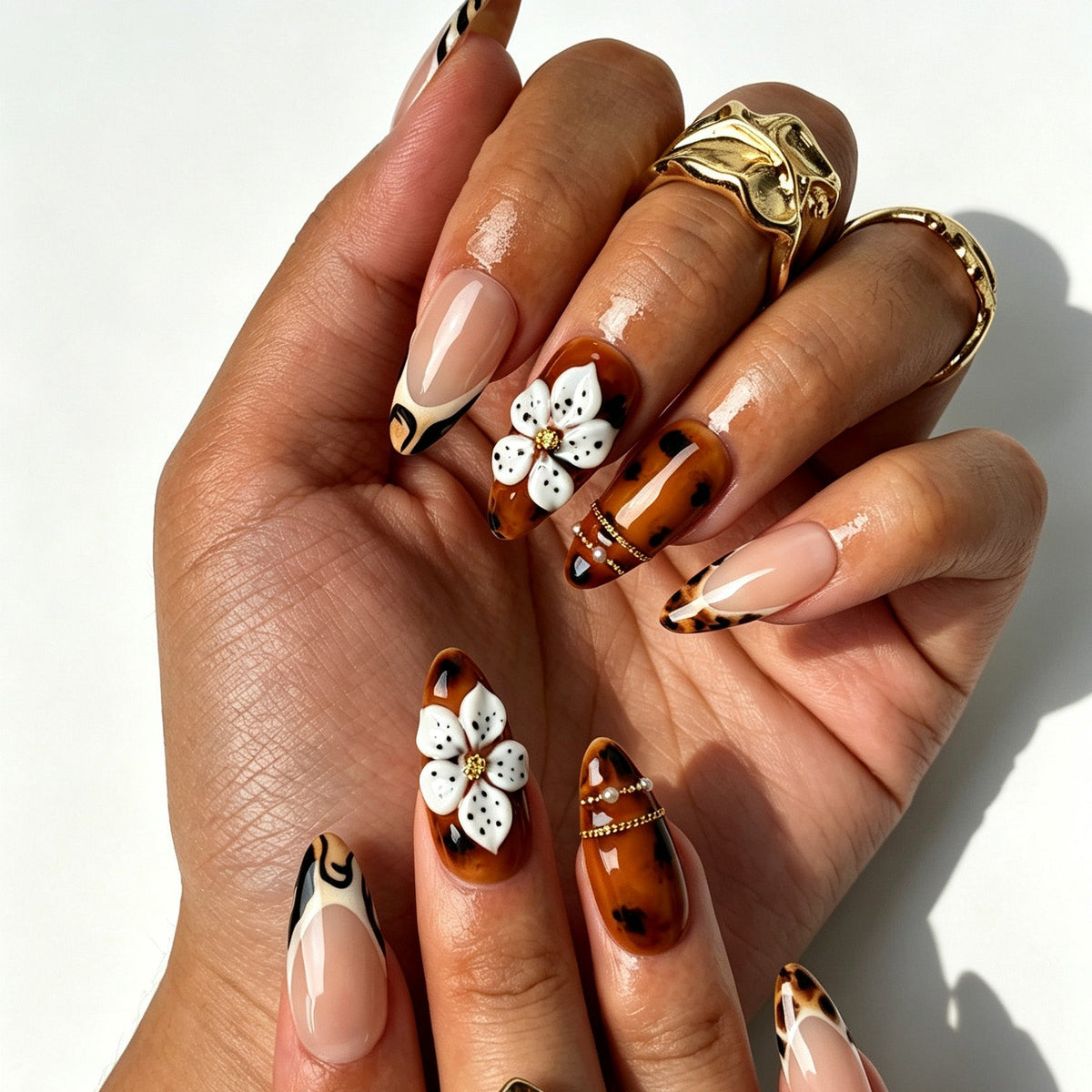 Handcrafted almond press on nails, bold tiger French tip design for fall styling, parties and concerts