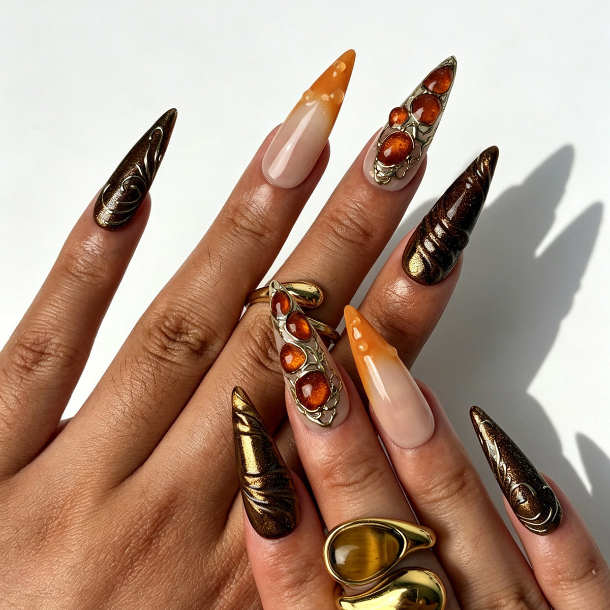 Boho-luxury stiletto false nails, nude orange gradient, 3D orange flower, amber cabochon and golden filigree