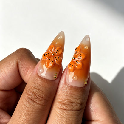 Bold stiletto press on nails, nude orange gradient, 3D orange flower, bronze swirl, amber cabochon and golden filigree