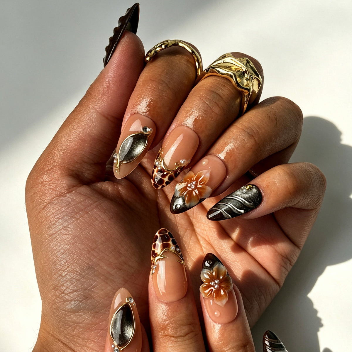 Handcrafted almond press on nails, brown cat eye shell gem design for beach styling, vacation and photoshoots