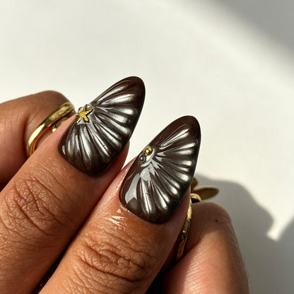 Dreamy almond press on nails, nude pink, brown cat-eye, 3D shell relief, gold star, oval gem, pearl flower and tortoiseshell tip