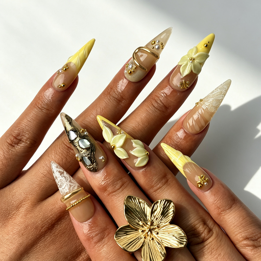 Cream Bloom cream nude gradient stiletto press on nails worn on hand, ivory flower gold metal minimalist elegant nail art