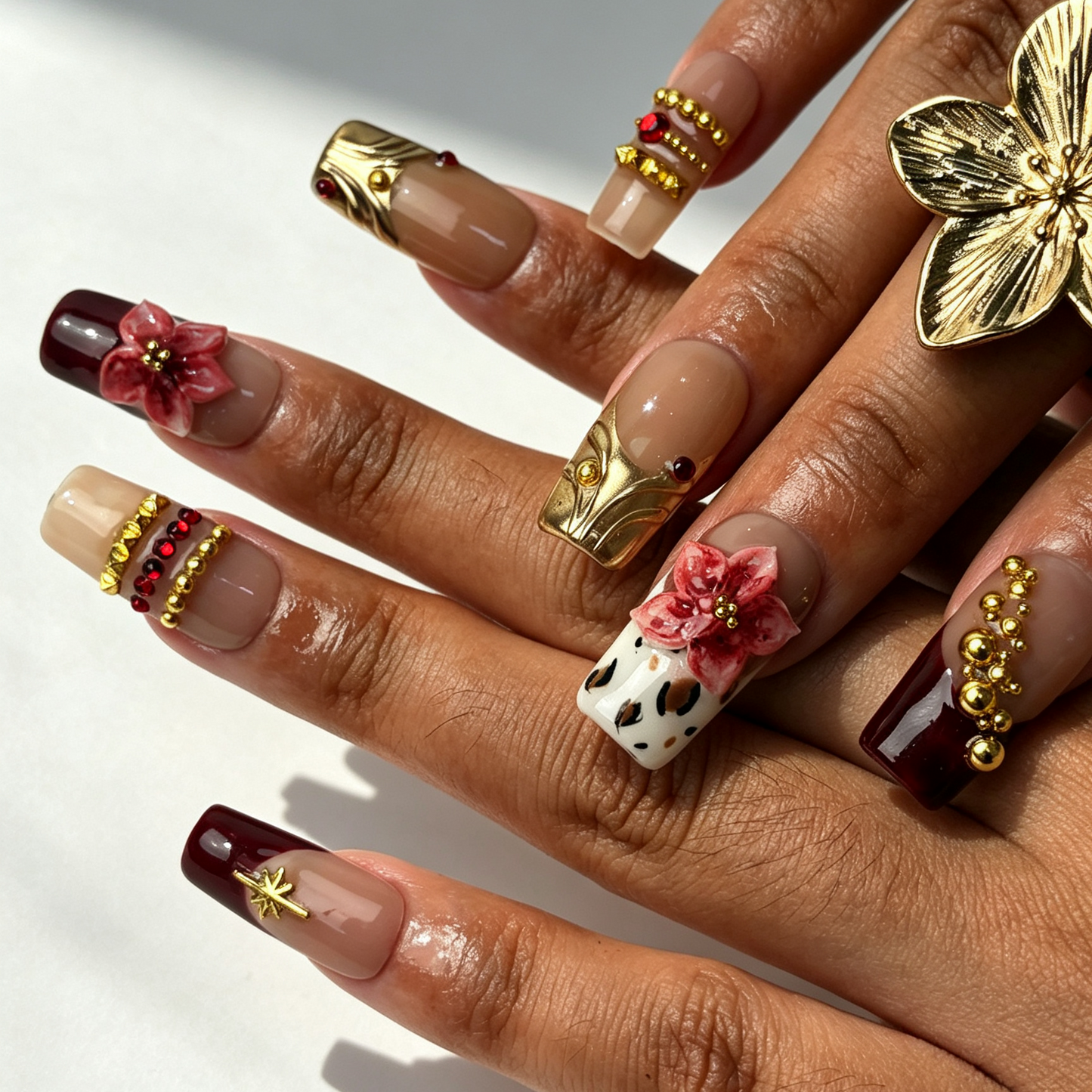 Burgundy Leopard vintage medium square false nails close-up, burgundy french tip, leopard floral gold bead manicure