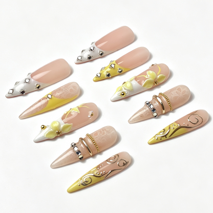 Lemon Lace handmade reusable stiletto nails, pastel yellow french tip, lace pattern, yellow flower and silver swirl embellishments