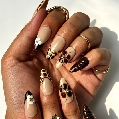 Handcrafted almond press on nails, caramel leopard French tip design for autumn outfits and coffee dates