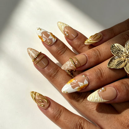 Minimalist ivory gold pearl almond nails banquet manicure shot