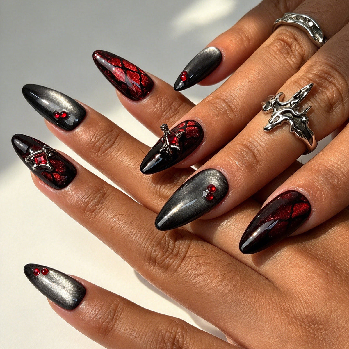 Crimson Bat almond press on nails, black red cat eye bat wing web nail art on hand