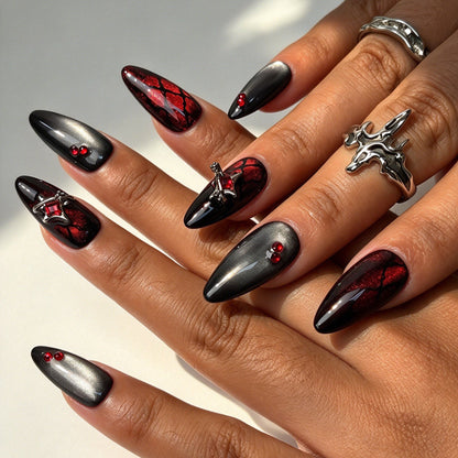 Crimson Bat almond press on nails, black red cat eye bat wing web nail art on hand
