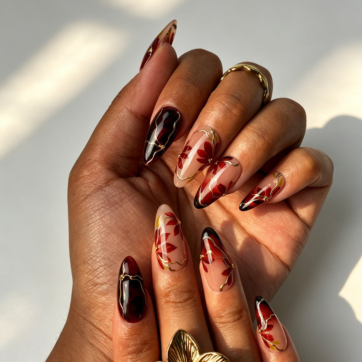 Handcrafted almond press on nails, moody red black ombre maple leaf design for date night and parties