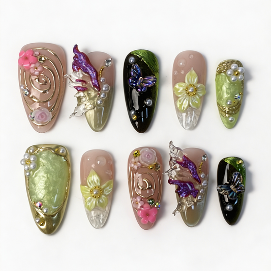 Iris‑Swirl medium almond press‑on nails, nude mint cat‑eye, iridescent butterfly, multi‑tone flower, gold swirl & pearl decor fake nails