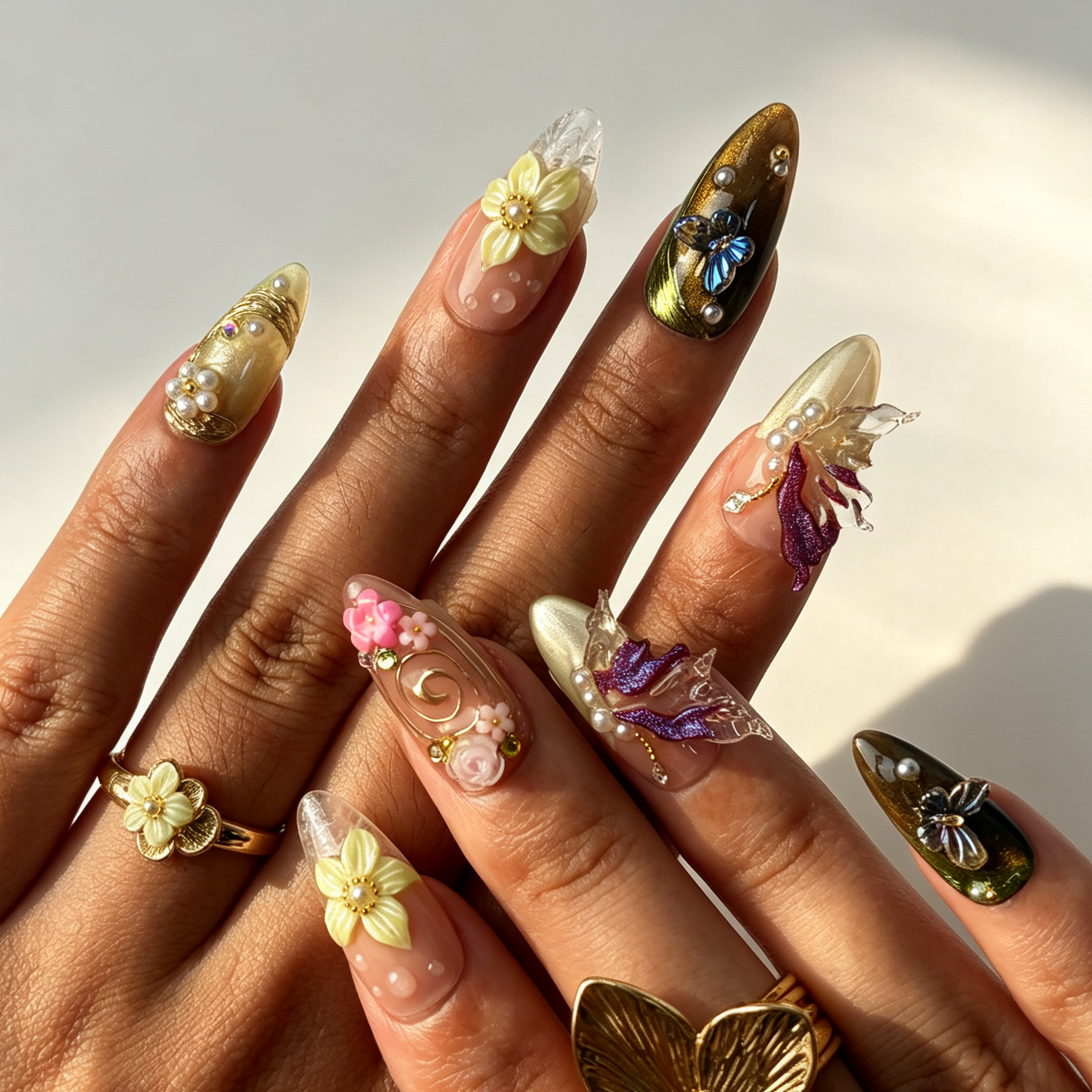Iris Swirl mint nude cat eye almond press on nails worn on hand, iridescent butterfly floral gold swirl spring nail art