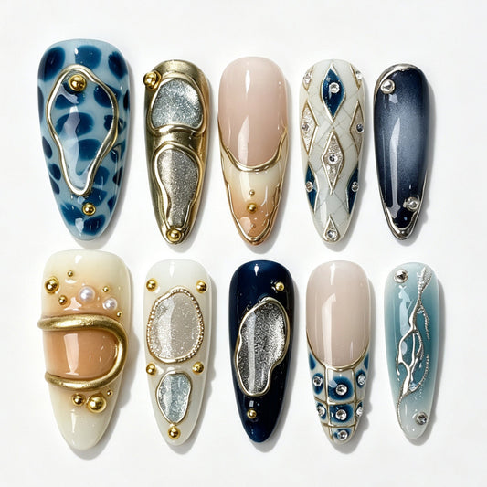 Long almond press‑on nails, cool‑tone blue leopard print gold‑metal rhombus rhinestone pearl luxury fake nails