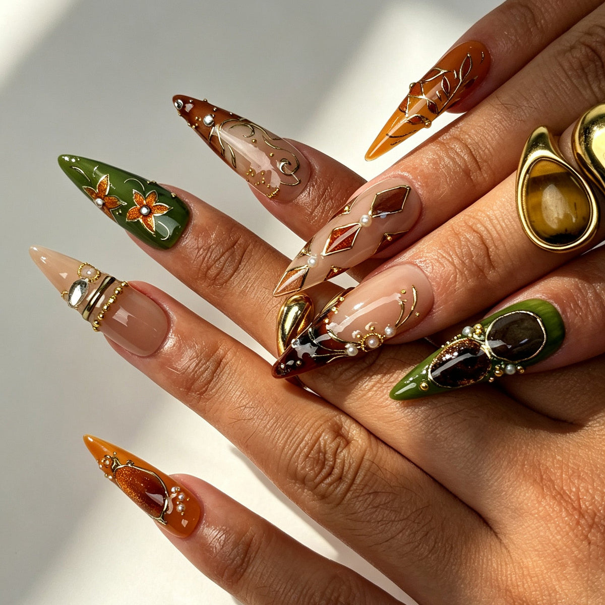 Forest Amber handmade stiletto press on nails, vintage boho-jeweled autumn nail art on hand