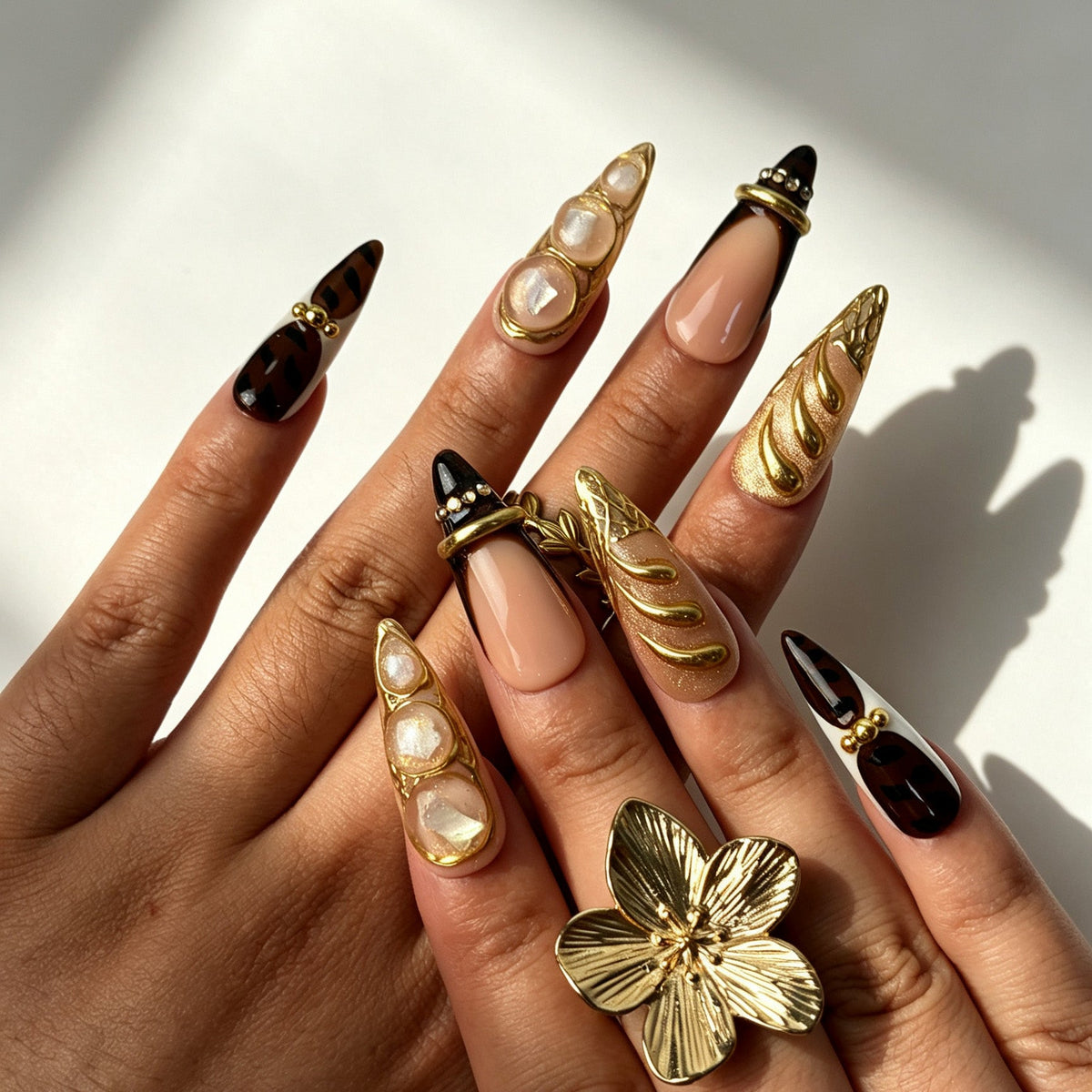 Garnet Gild handmade stiletto press‑on nails real‑hand close‑up
