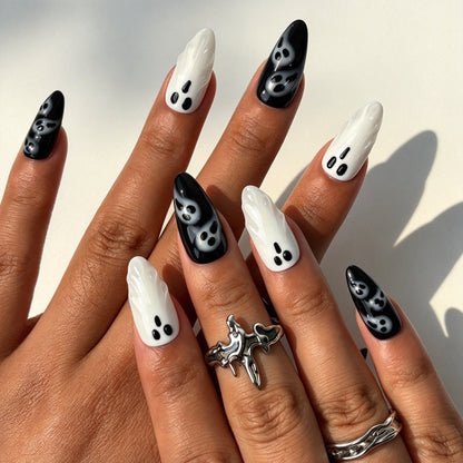 Ghostly Chic almond press on nails, black white cute ghost nail art on hand