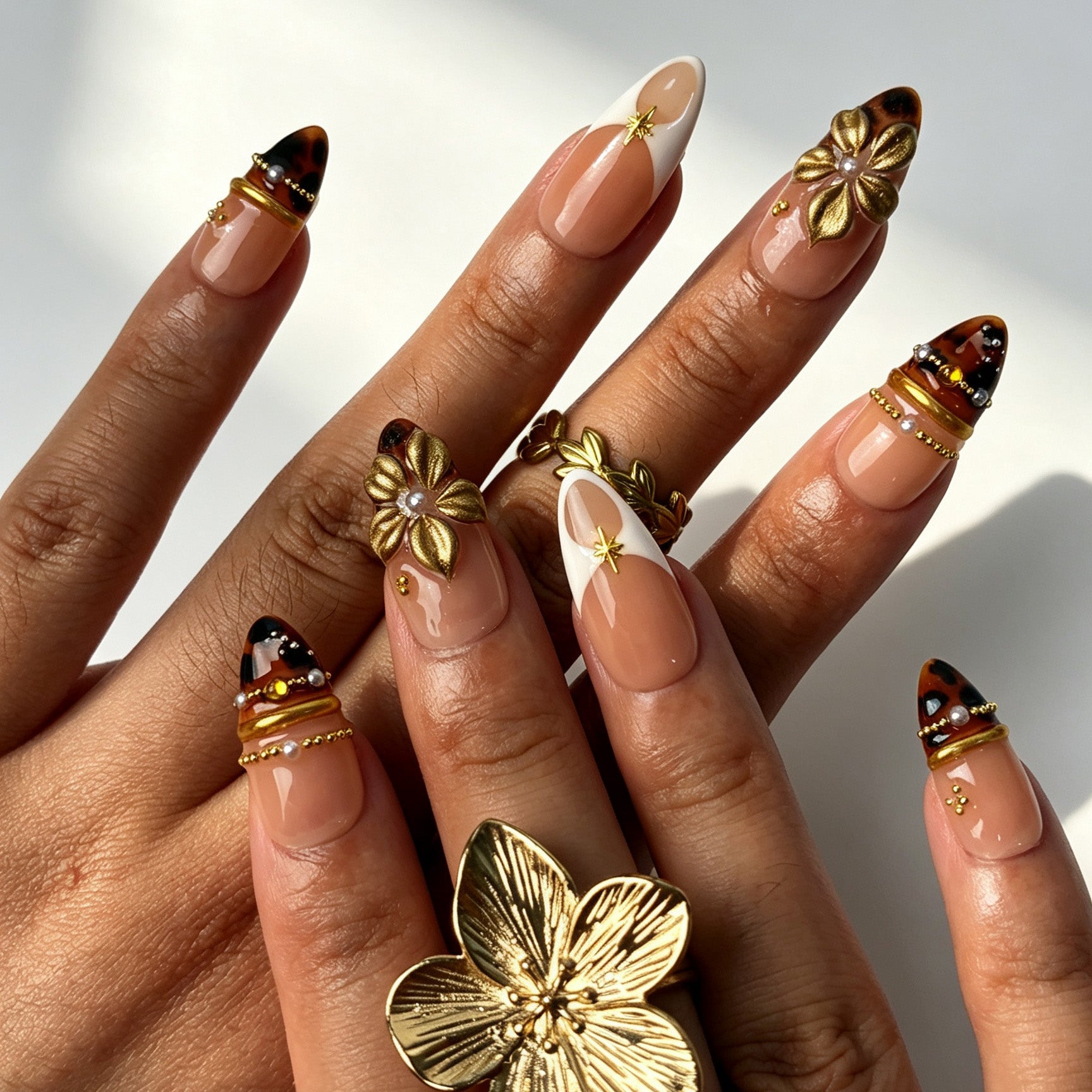 Handmade tortoiseshell ombre french press‑on nails with metallic gold flower and pearl details