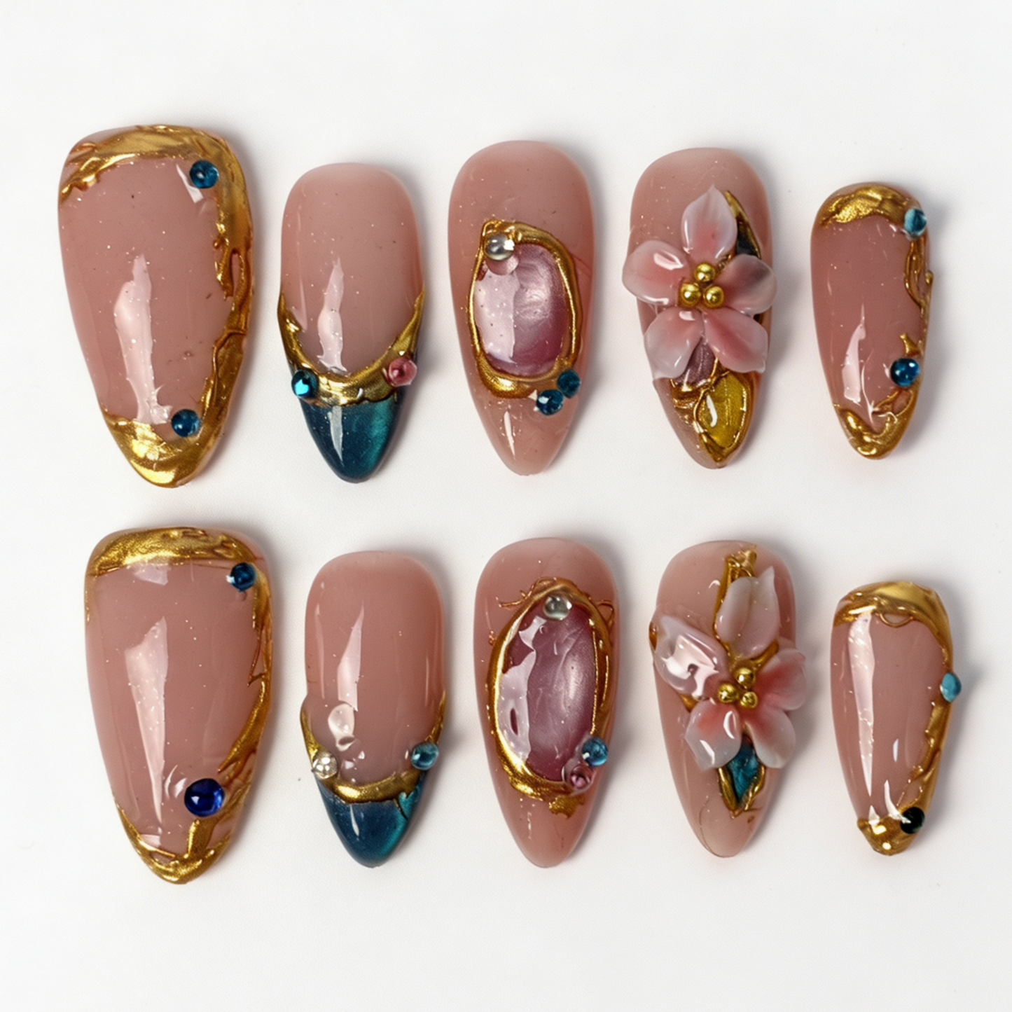 Teal Gilded medium almond press on nails, nude jade teal cat eye french tip, gilded frame, translucent pink flower and mixed rhinestone decor