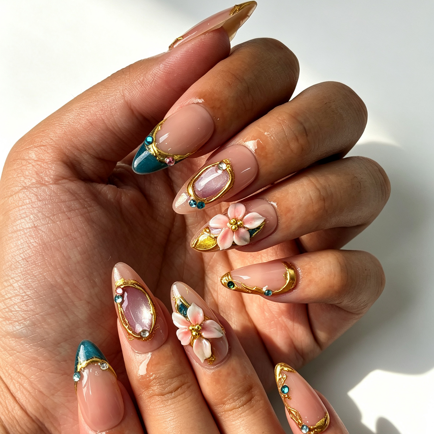 Teal Gilded jade teal cat eye almond press on nails worn on hand, gilded floral design for office and spring dating manicure