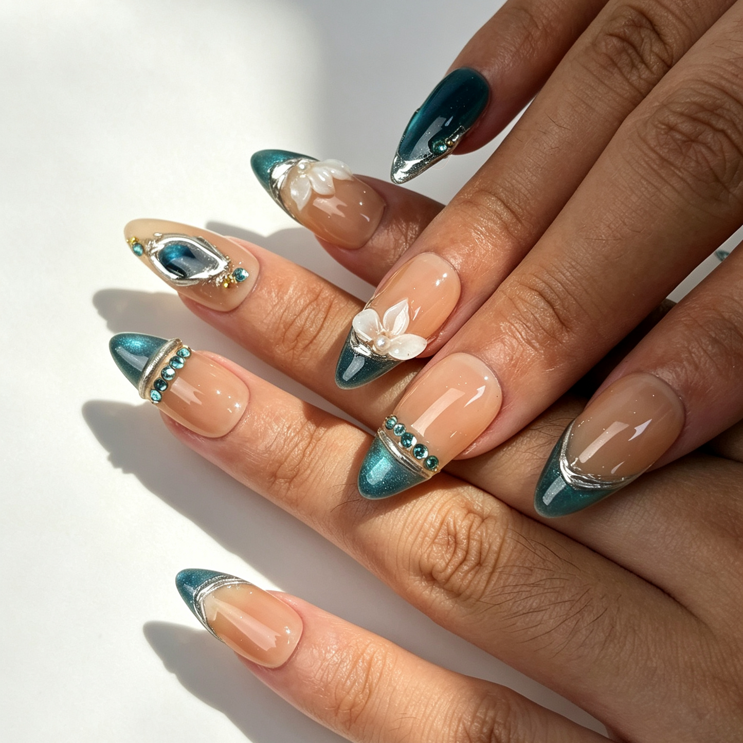 Jade Lotus Mirror elegant medium almond false nails close-up, teal cat eye french tip lotus pearl office manicure