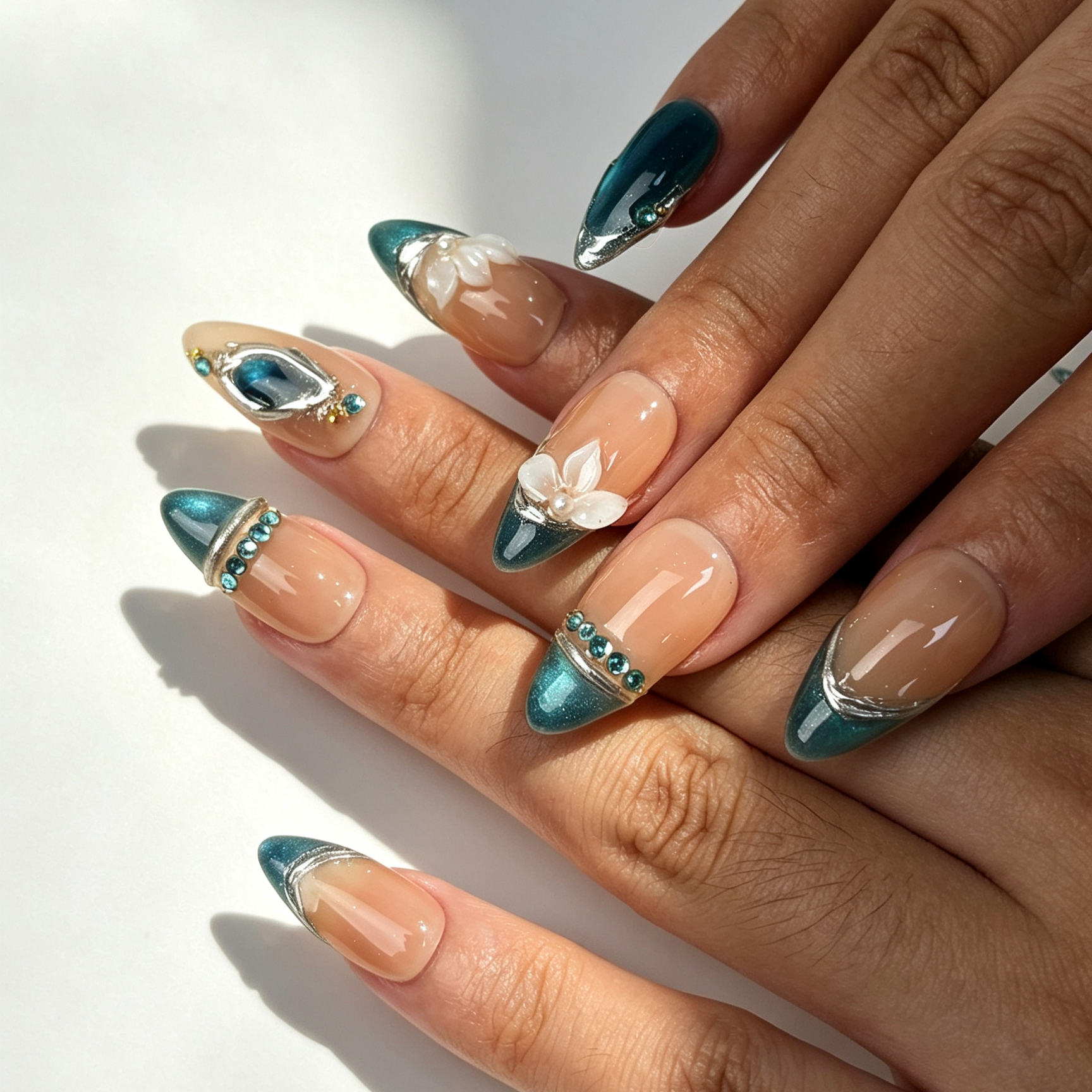 Jade Lotus Mirror elegant medium almond false nails close-up, teal cat eye french tip lotus pearl office manicure