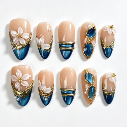 Teal Petal medium almond press on nails, nude teal cat eye french tip, hollow gilded frame, translucent white flower and pearl decor