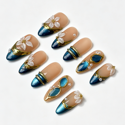 Teal Petal oriental fake nail set, nude shimmer teal cat eye base, sculpted white floral and pearl embellishments