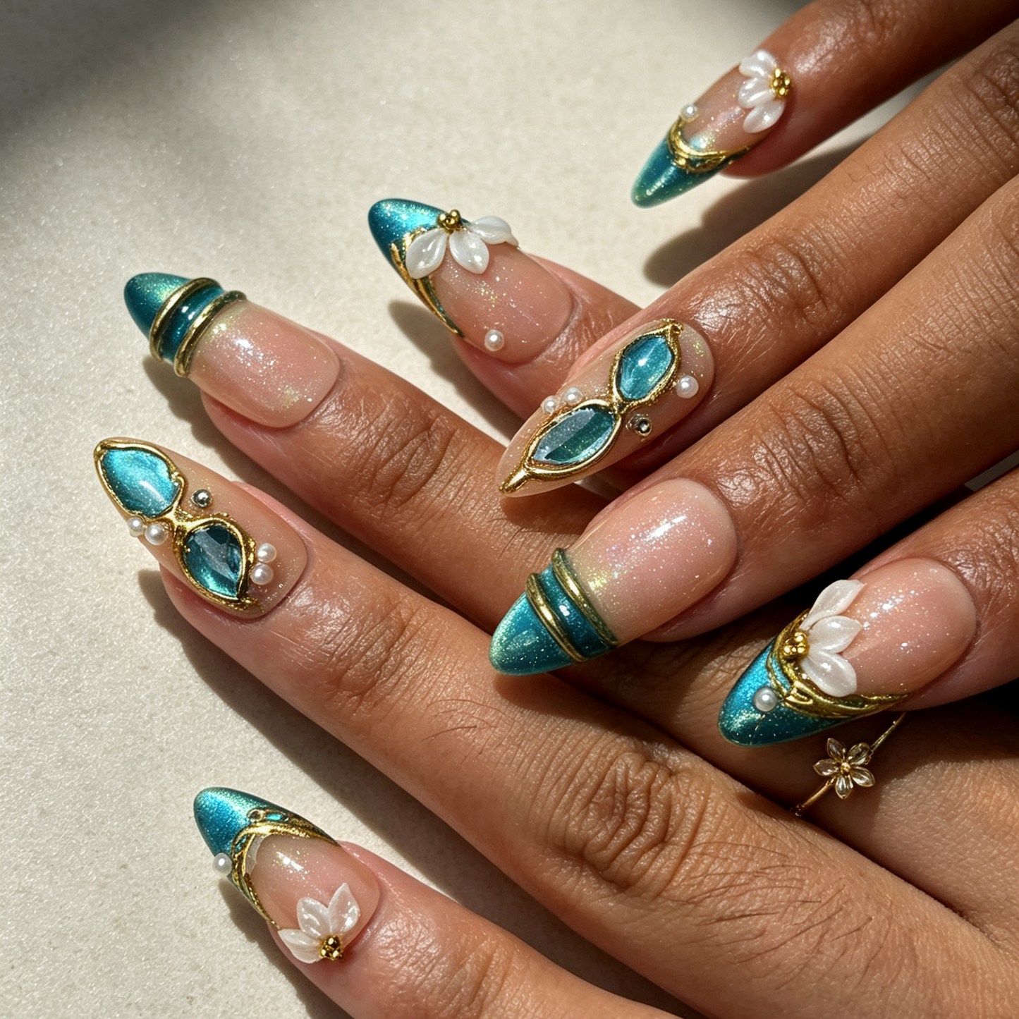Teal Petal elegant almond false nails close-up, teal cat eye french tip floral pearl dating manicure