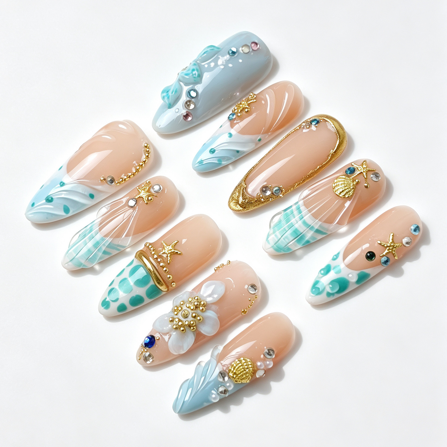Tide Shell summer ocean fake nail set, nude base with blue wave tip, 3D wave texture, golden seashell starfish embellishments