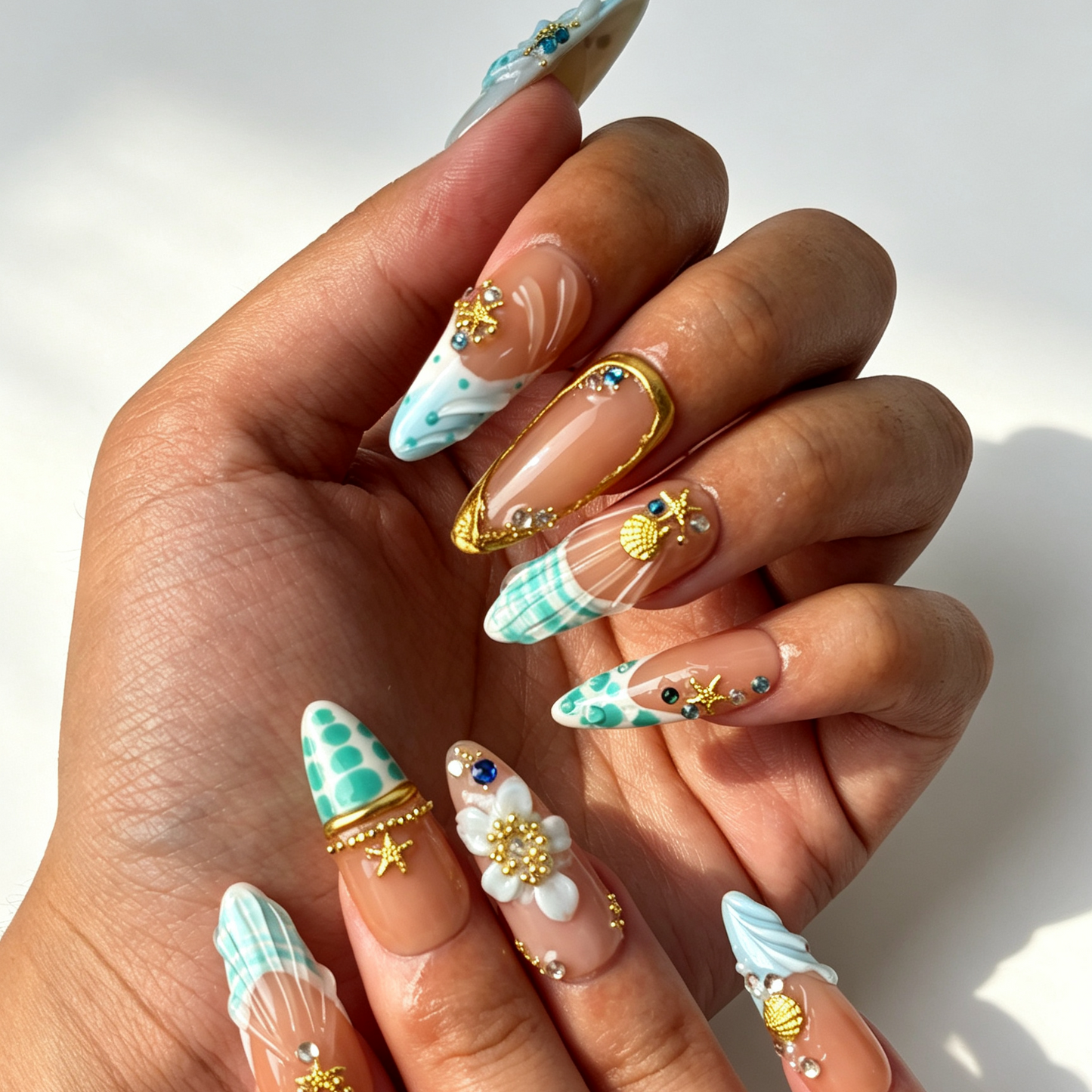 Tide Shell summer ocean long almond false nails, blue wave design with golden starfish and colorful rhinestones