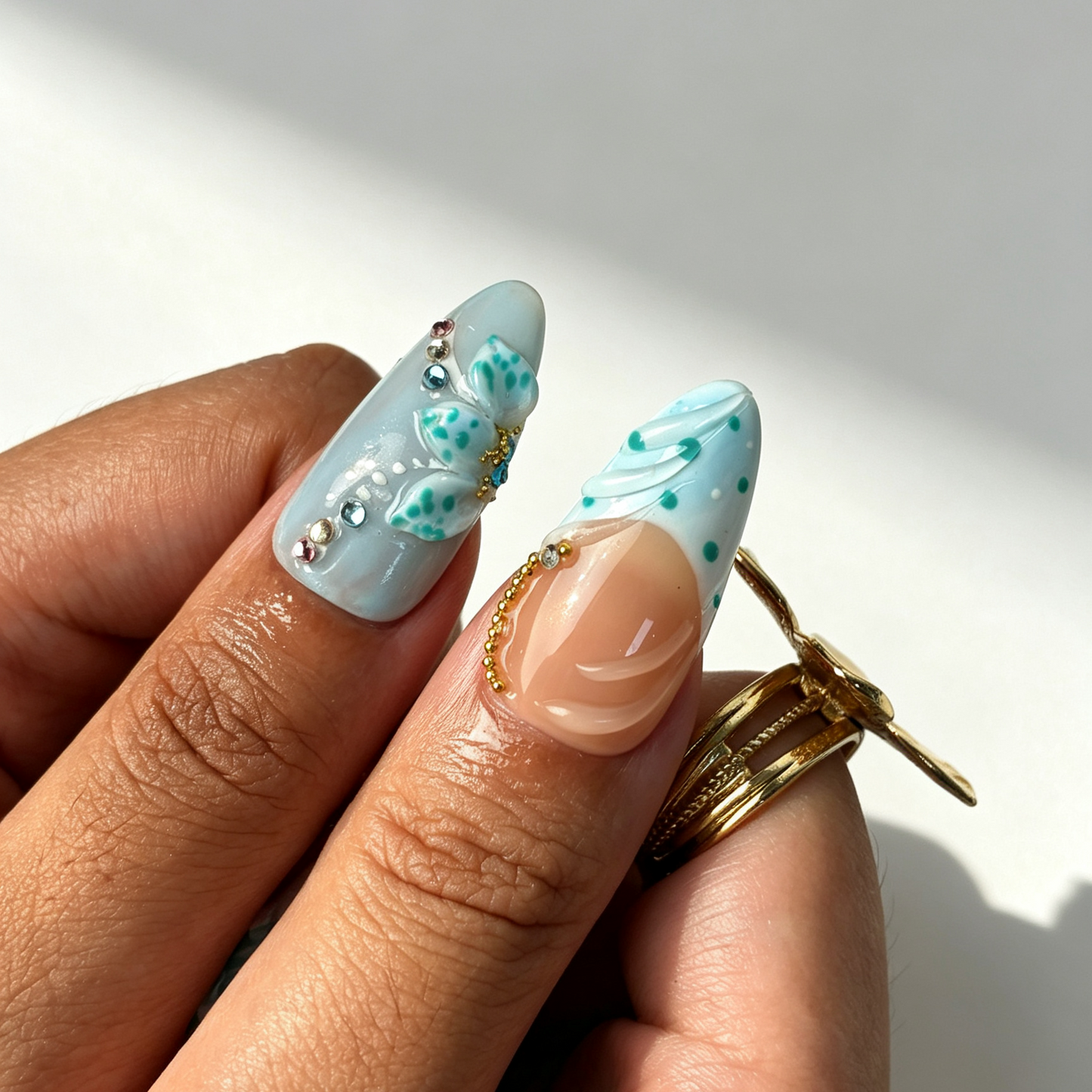 Tide Shell beach wearable press on nails, sheer nude base, wave texture seashell detail close-up hand shot
