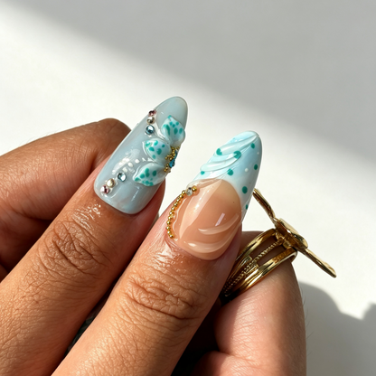 Tide Shell beach wearable press on nails, sheer nude base, wave texture seashell detail close-up hand shot