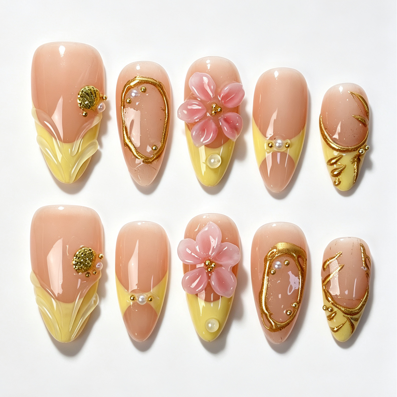 Butter Filigree medium almond press on nails, sheer peach nude base with butter yellow french tip, pink cherry blossom, gold frame and tiny pearl decor