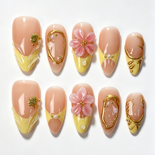 Butter‑Blossom almond press‑on nails, butter yellow tip, pink 3D blossom flower, gold foil lines and pearl decor fake nails