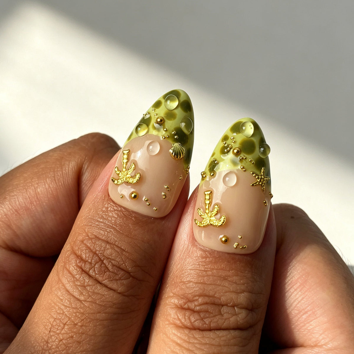Gold foil green swirl tropical press‑on nails macro detail shot