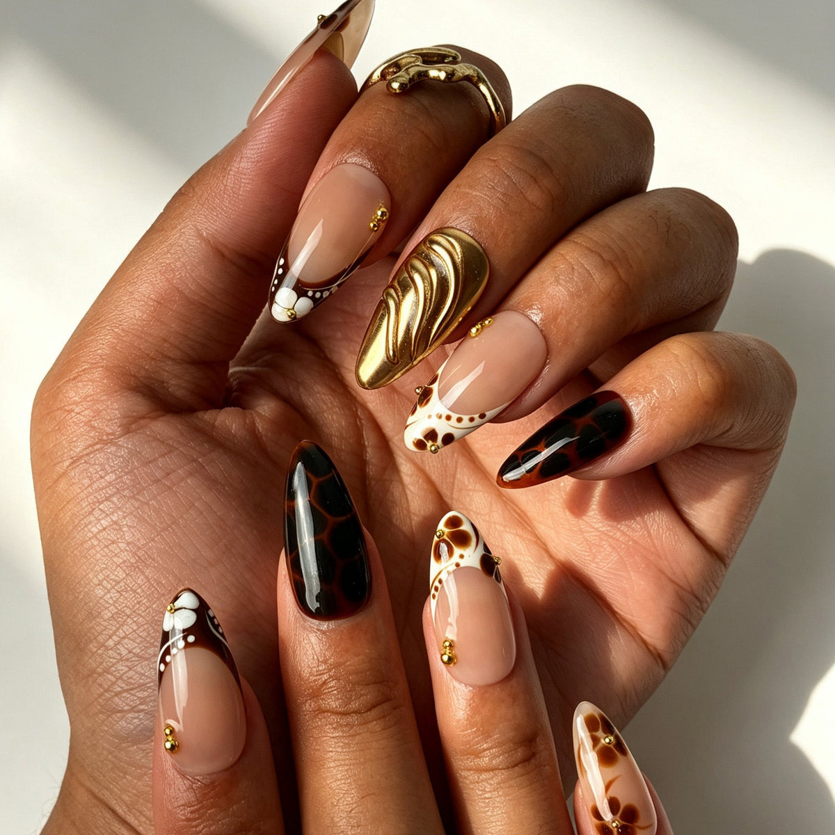 Handcrafted almond press on nails, warm brown flower design for autumn styling, dates and elegant daily wear