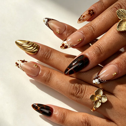 Mocha Blossom handmade almond press on nails, warm maillard brown flower tortoiseshell nail art on hand