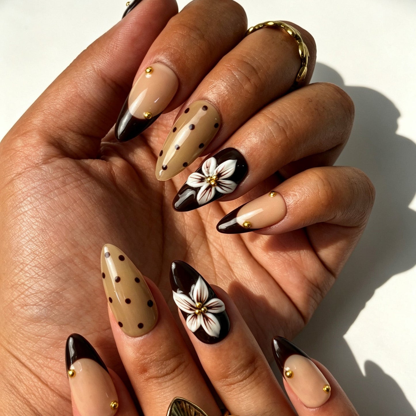 Retro mocha dot almond press‑on nails, chocolate brown nail set with gold bead flower detail