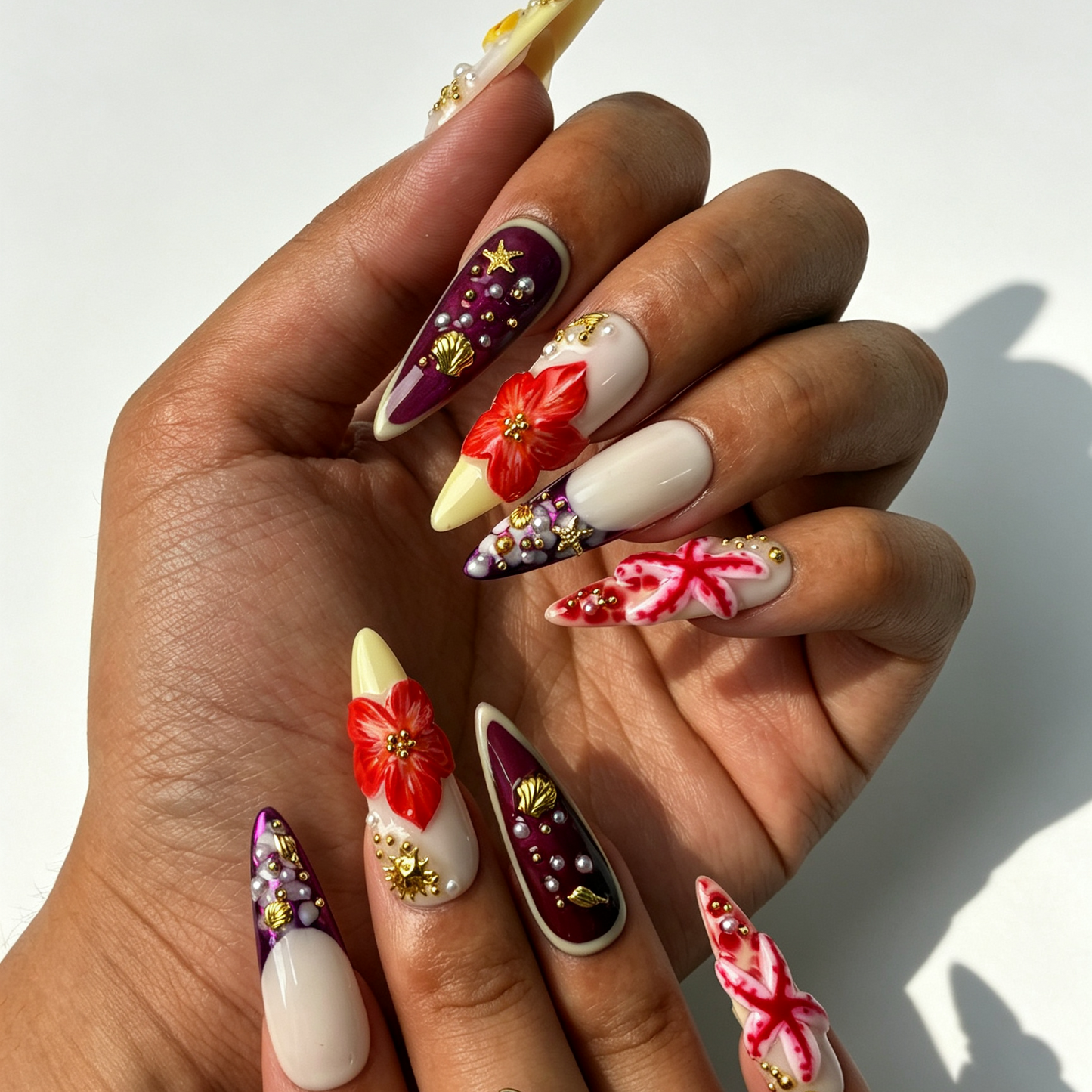 Coral Tide coral red gradient stiletto press on nails worn on hand, seashell starfish tropical flower summer beach nail art