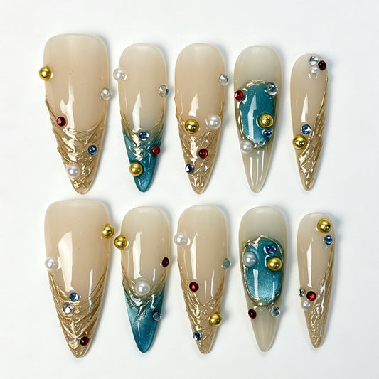 Long stiletto press‑on nails, nude teal gradient gilded‑texture gold pearl rhinestone luxury fake nails