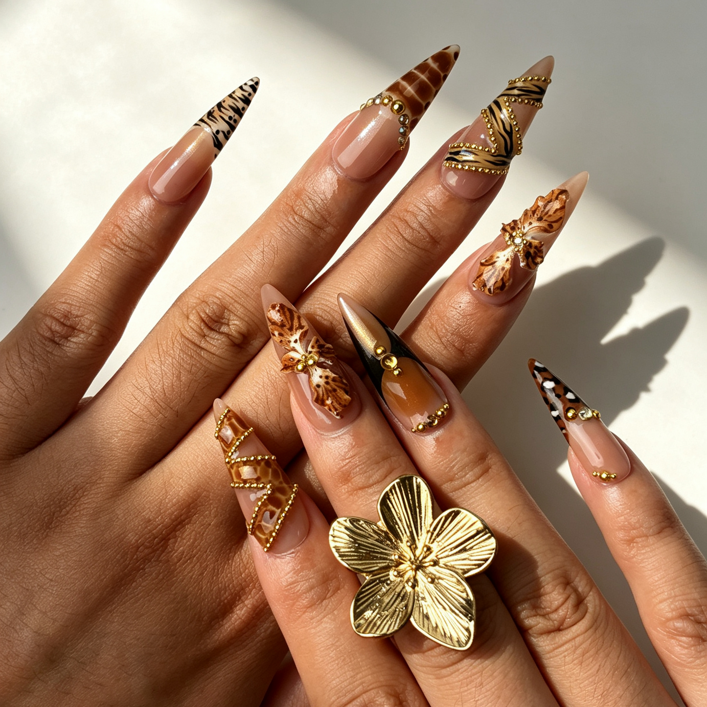 Close-up handmade stiletto nails 3D bow gold rhinestone chain exquisite decoration