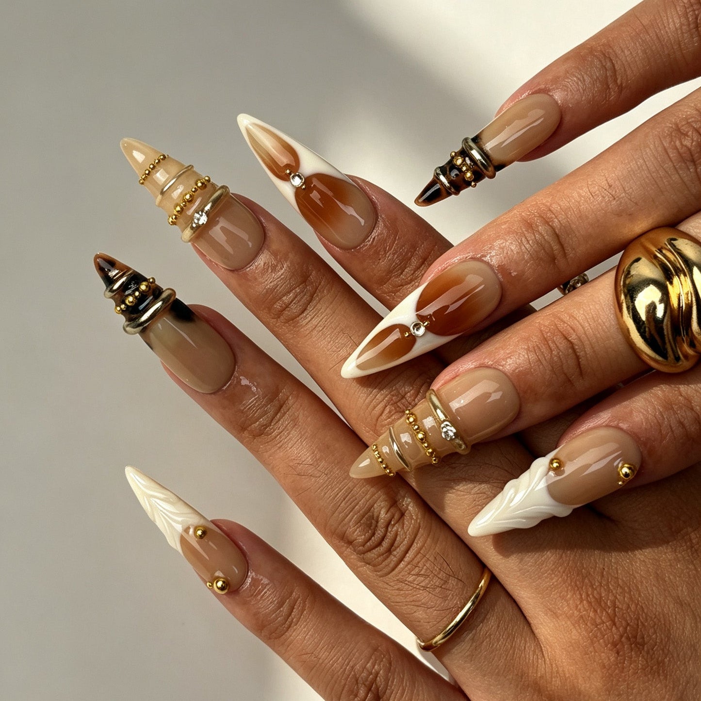Amber Ring Warm Tone Stiletto Nails Hand Worn Manicure