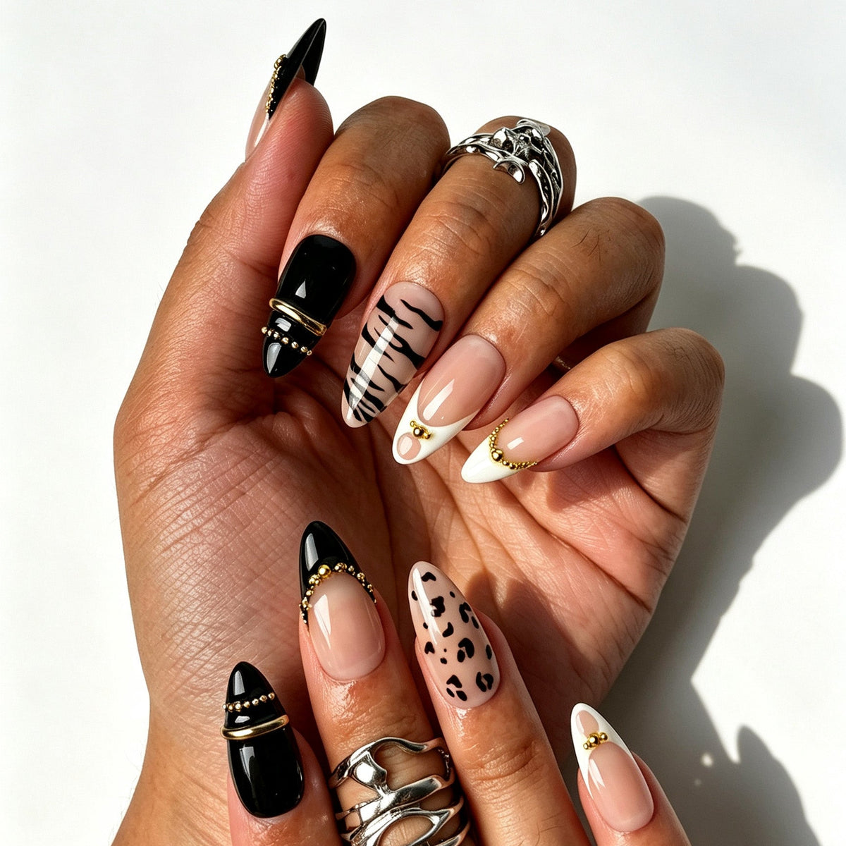 Handcrafted almond press on nails, zebra leopard French tip nail design for party styling